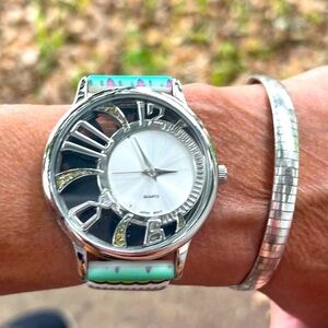 Silver tone multicolored Paisley print silicon band.l Latch rose colored gold.